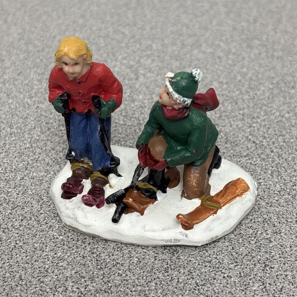St Nicholas Square Christmas Village Children Skiing Figurine